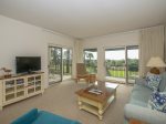 Enjoy views of the water from the living area with new furniture at 1824 Beachside Tennis